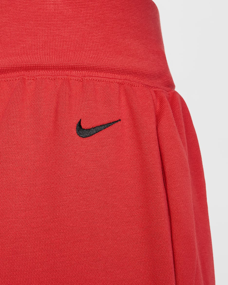 Calças folgadas em tecido moletão e com cintura normal Nike Sportswear Breaking para mulher - Carmesim claro