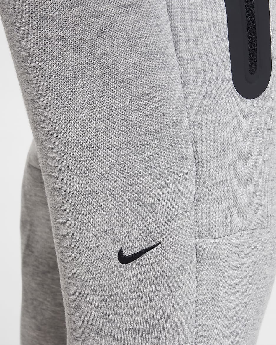 Běžecké kalhoty Nike Sportswear Tech Fleece pro větší děti (dívky) - Dark Grey Heather/Černá/Černá/Černá