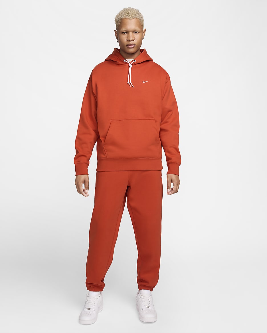 Pantalon en tissu Fleece Nike Solo Swoosh pour Homme - Dragon Red/Blanc