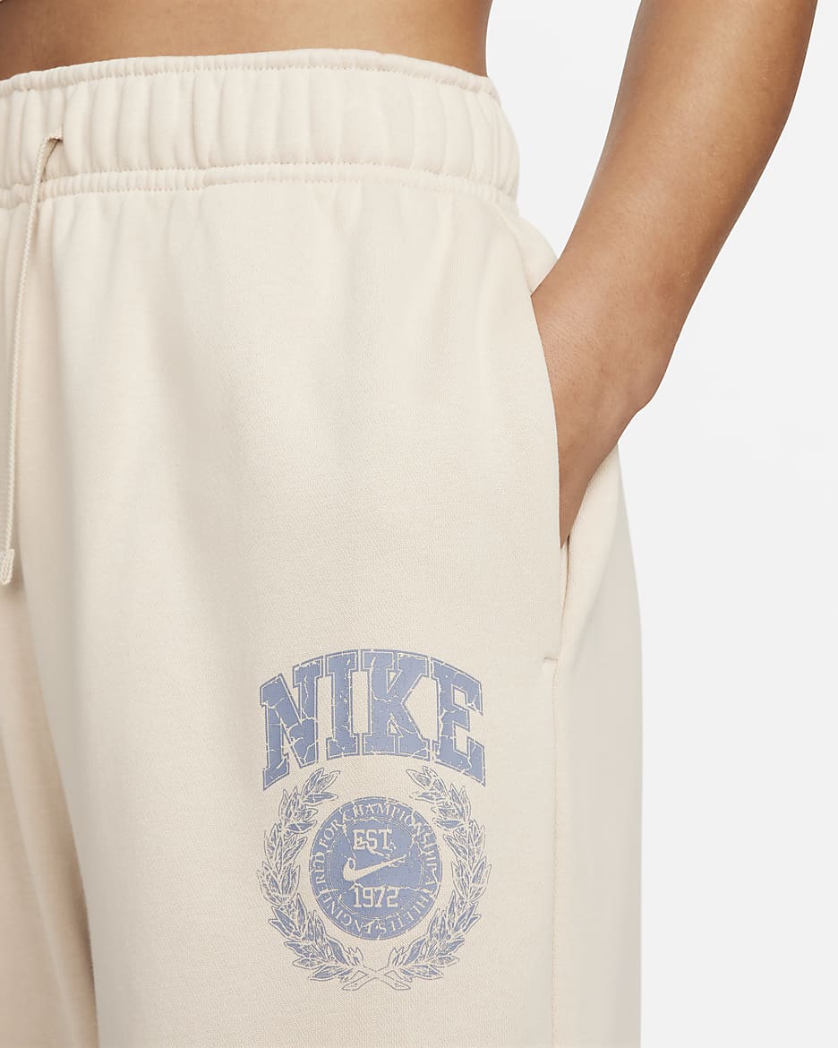 Pants de entrenamiento oversized de tiro medio para mujer Nike Sportswear Club Fleece - Duna