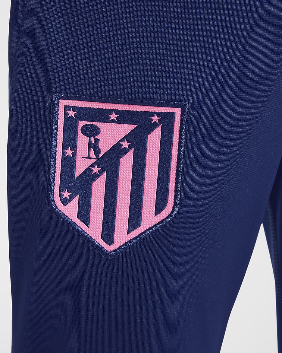 Atlético Madrid Strike Third Nike Dri-FIT Fußball-Trainingsanzug aus Strickmaterial für ältere Kinder - Pink Glow/Blue Void/Blue Void