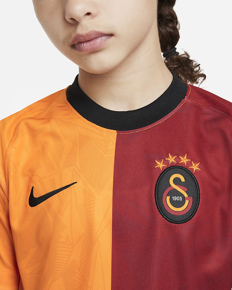 Galatasaray 2022/23 hazai Nike Dri-FIT rövid ujjú futballfelső nagyobb gyerekeknek - Vivid Orange/Vivid Orange/Pepper Red/Vivid Orange