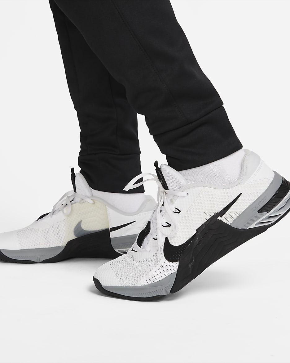 Träningsbyxor Nike Therma-FIT i avsmalnande modell för män - Svart/Svart/Vit