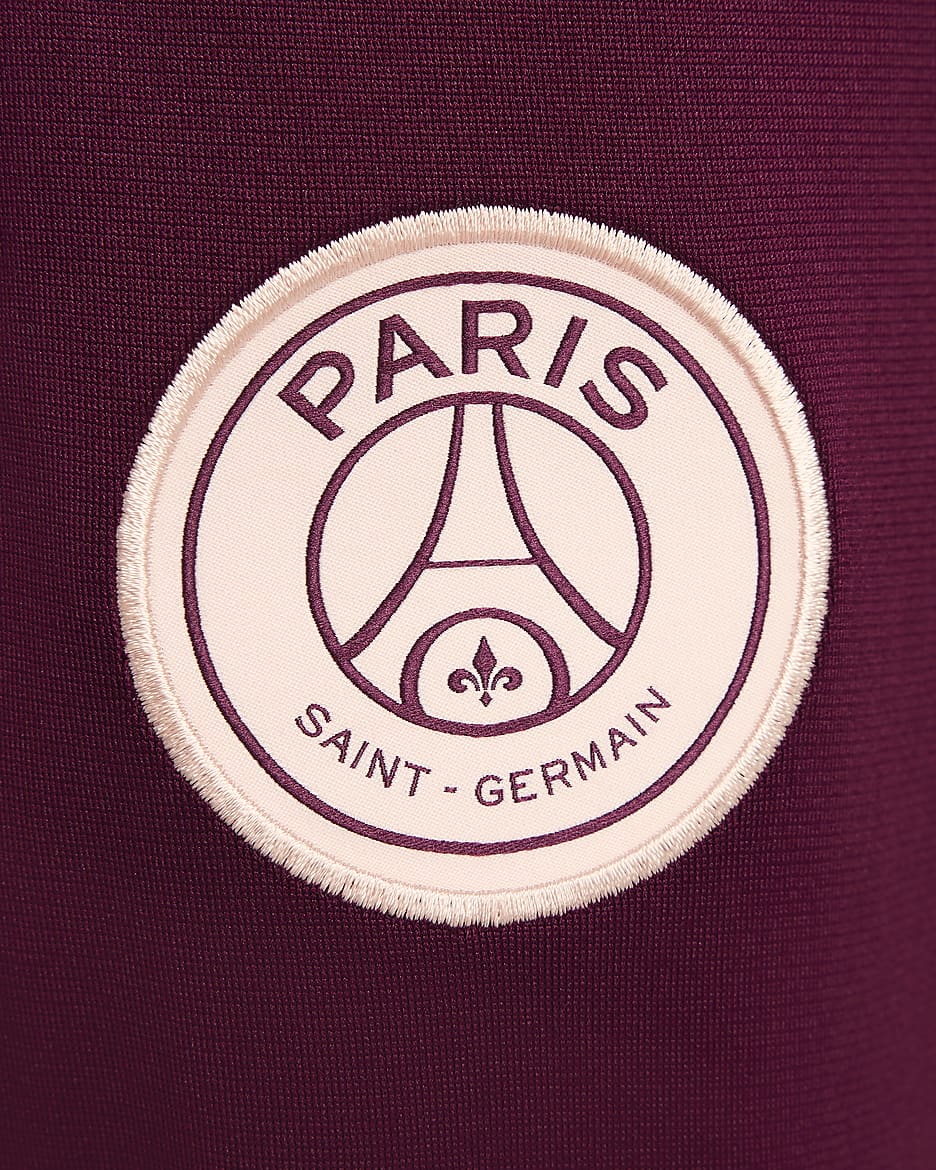 Pleteninová fotbalová tepláková souprava Nike Dri-FIT Paris Saint-Germain Strike pro větší děti - Geode Teal/Bordeaux/Guava Ice