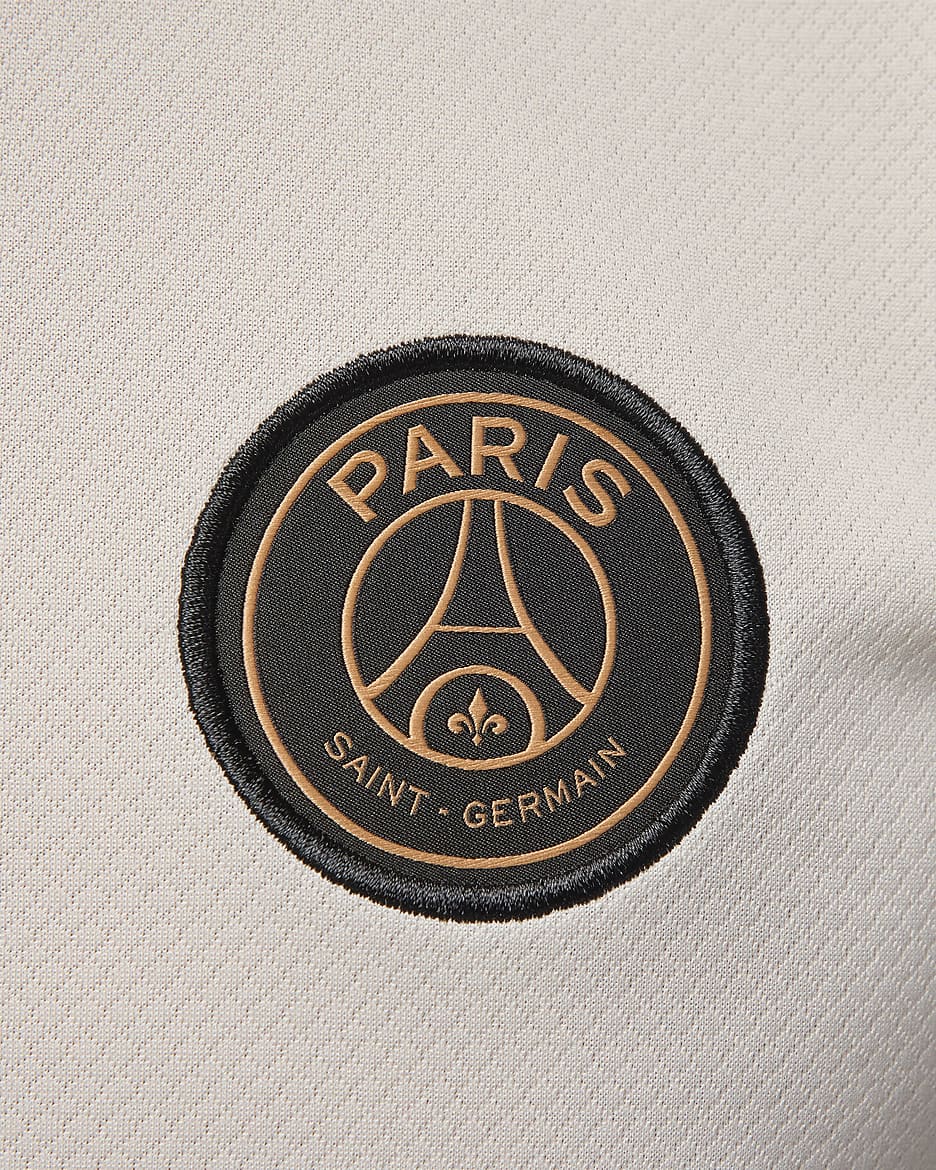 Męska koszulka piłkarska z dzianiny z krótkim rękawem Jordan Dri-FIT Paris Saint-Germain Strike (wersja trzecia) - Pale Ivory/Pale Ivory/Rust Pink/Czerń