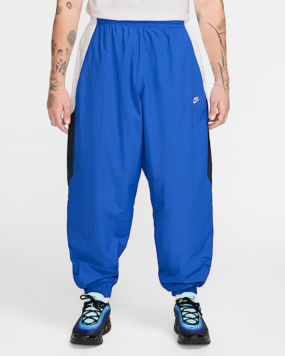 Pants deportivos de tejido Woven oversized para hombre Nike Club - Royal juego/Blanco/Obsidiana/Blanco