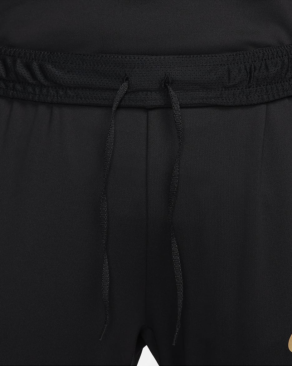 Nike Strike Pantalón de fútbol Dri-FIT - Mujer - Negro/Jersey Gold/Oro metalizado