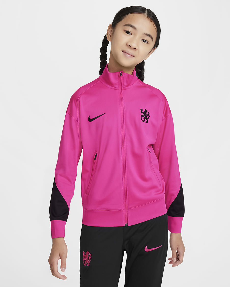 Třetí pleteninová fotbalová tepláková souprava Nike Dri-FIT Chelsea FC Strike pro větší děti - Pink Prime/Černá/Černá/Černá