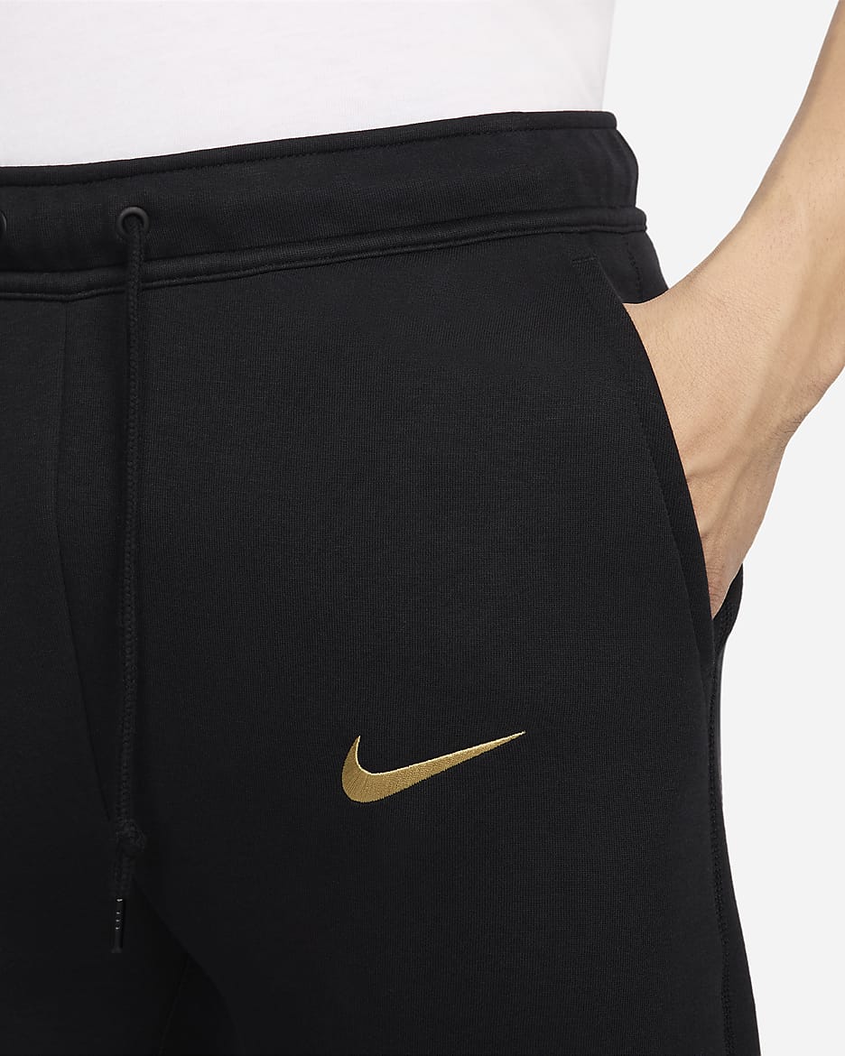 Calças desportivas de futebol Nike Tech Fleece FC Barcelona para homem - Preto/Dourado Club