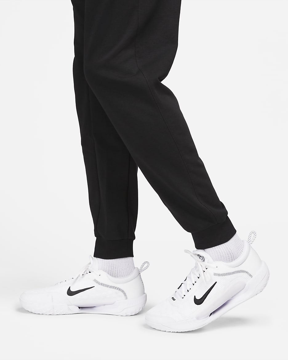 Calças de ténis em tecido moletão NikeCourt Heritage para homem - Preto