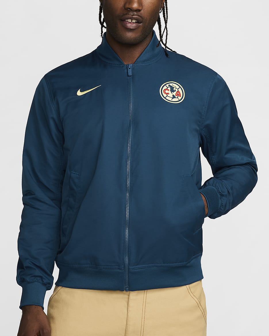 Chamarra bomber de fútbol Nike de tejido Woven y sin forro para hombre Club América Sport Essentials - Azul valeriana/Chifón limón