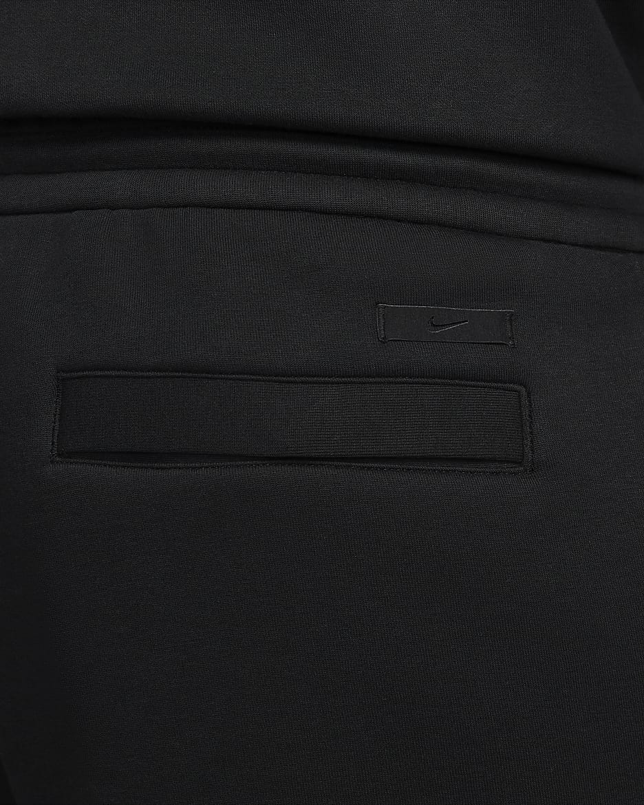 Nike Sportswear Tech Fleece Reimagined Herren-Trainingshose mit offener Passform und offenem Saum - Schwarz/Schwarz