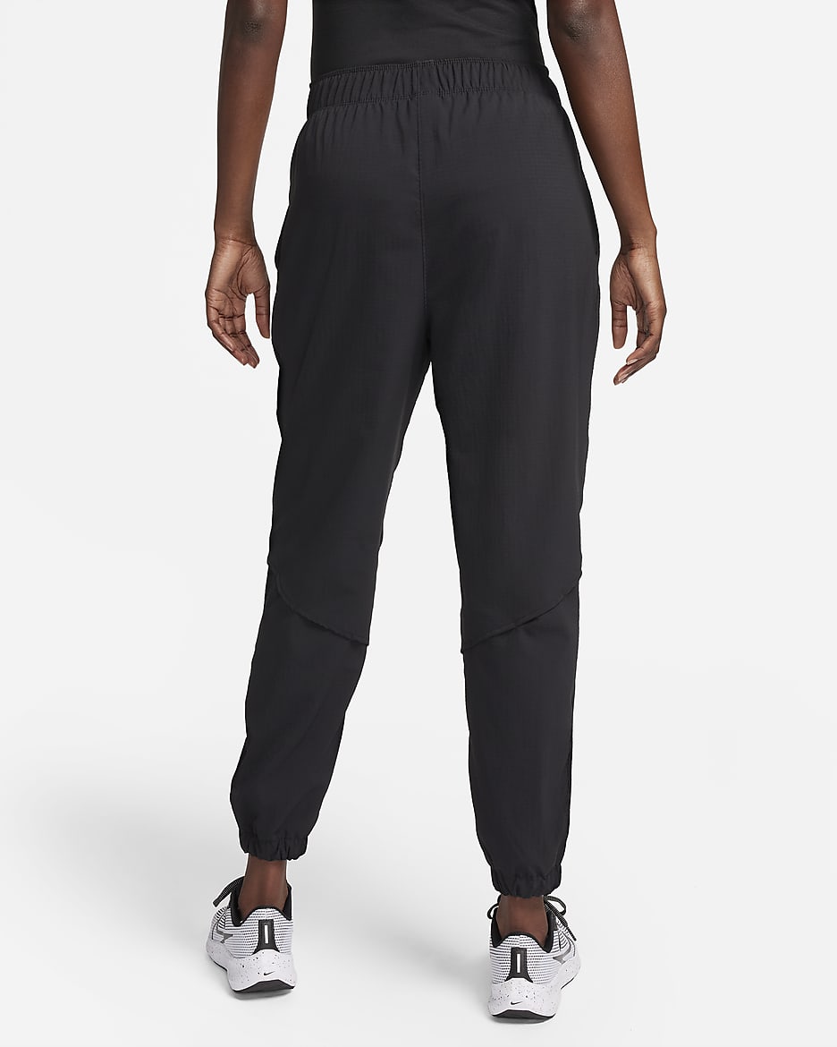 Pantaloni da running da riscaldamento a 7/8 a vita media Nike Dri-FIT Fast – Donna - Nero