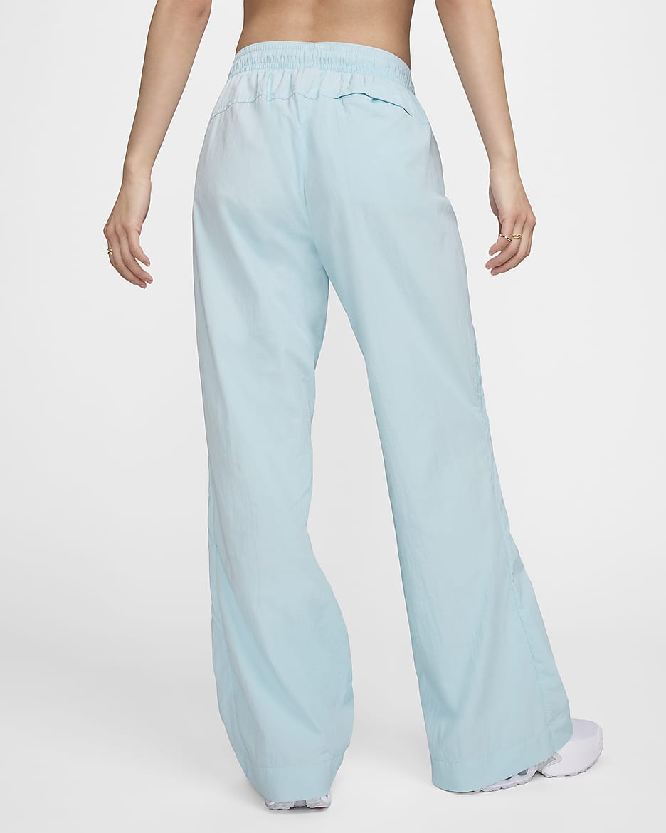 Pantalon à zip taille mi-haute déperlant Nike Sportswear Collection pour femme - Glacier Blue/Blanc