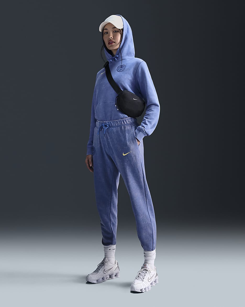 Pants de fútbol Nike de tiro medio del Club América alternativo Club Fleece para mujer - Azul medio/Chifón limón