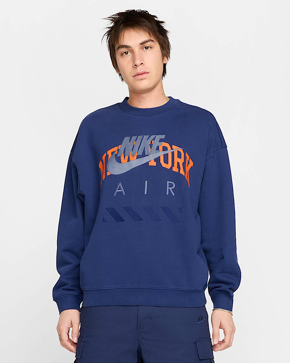Sudadera de cuello redondo de tejido Fleece NYC para hombre Nike Air - Azul vacío/Naranja seguridad/Blanco