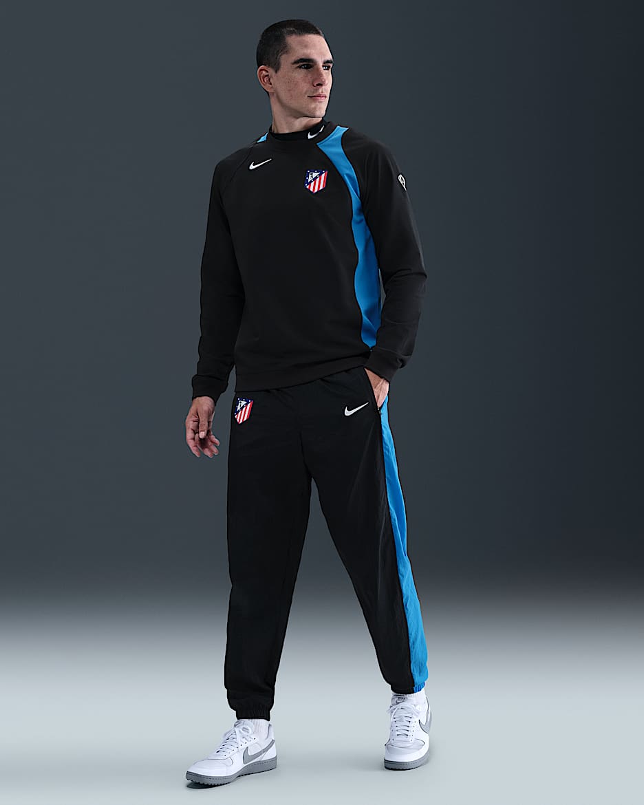 Track pants da calcio in tessuto Nike Total 90 Atlético de Madrid da uomo – Terza - Nero/Photo Blue/Bianco