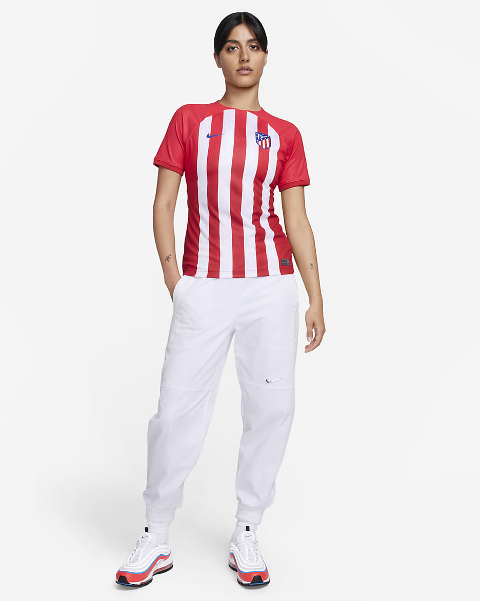 Jersey de fútbol Nike Dri-FIT del Club Atlético de Madrid local 2023/24 Stadium para mujer - Rojo deportivo/Rojo mundial/Blanco/Azul eléctrico