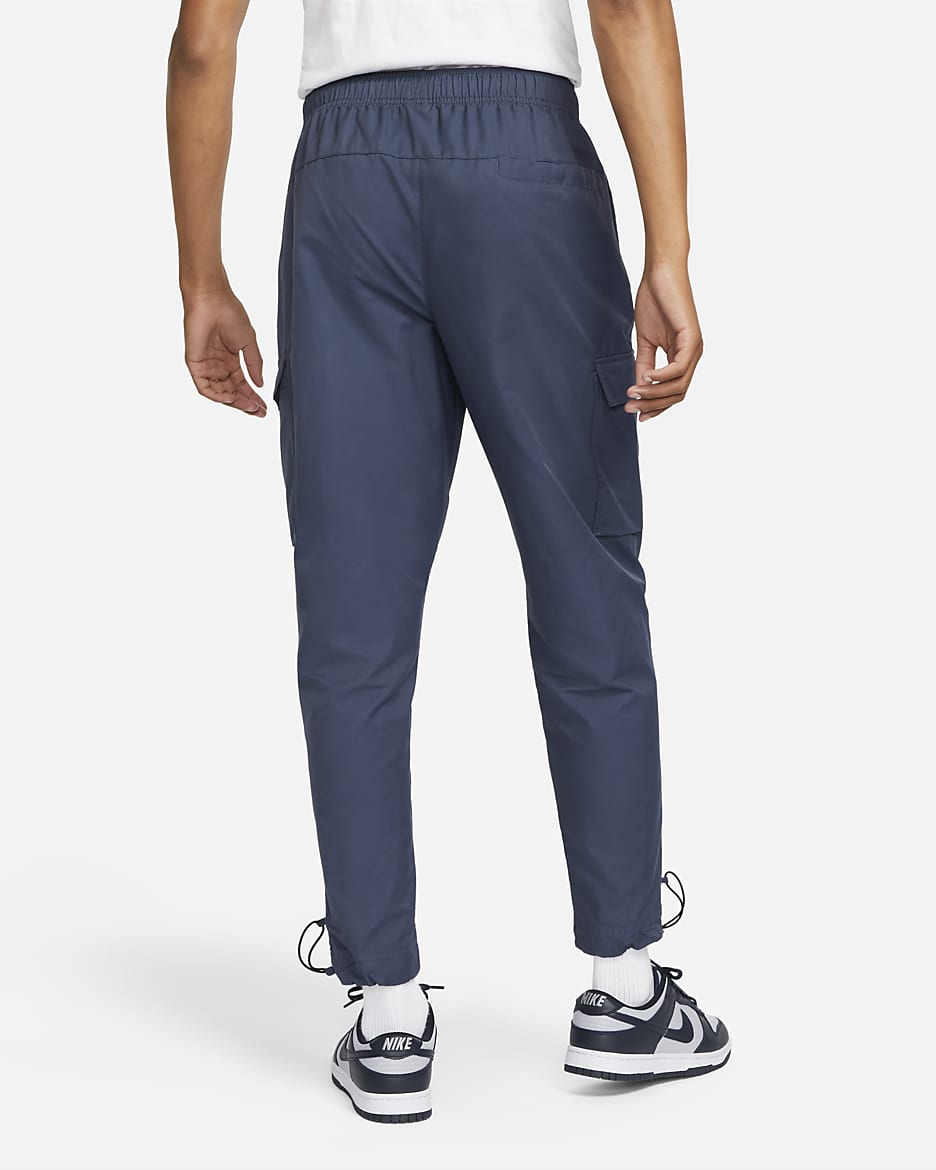 Vævede Nike Sportswear Repeat-bukser til mænd - Thunder Blue/hvid