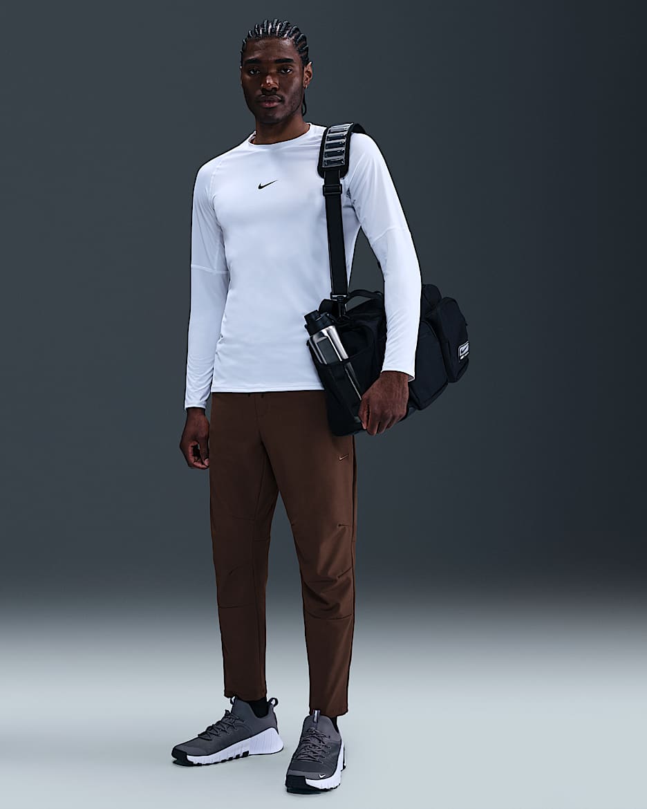 Pants versátiles Dri-FIT de pierna entallada para hombre Nike Unlimited - Marrón barroco/Negro/Marrón barroco