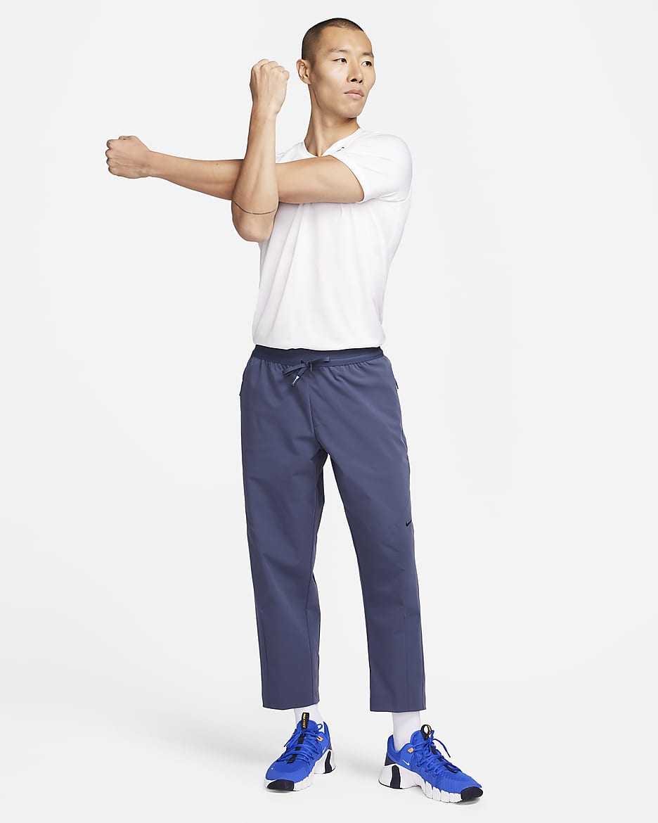 Nike A.P.S. Pantaloni versatili in tessuto Dri-FIT – Uomo - Thunder Blue/Nero