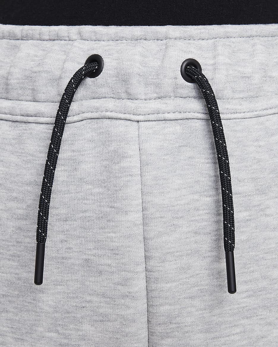 Běžecké kalhoty Nike Sportswear Tech Fleece pro větší děti (dívky) - Dark Grey Heather/Černá/Černá/Černá