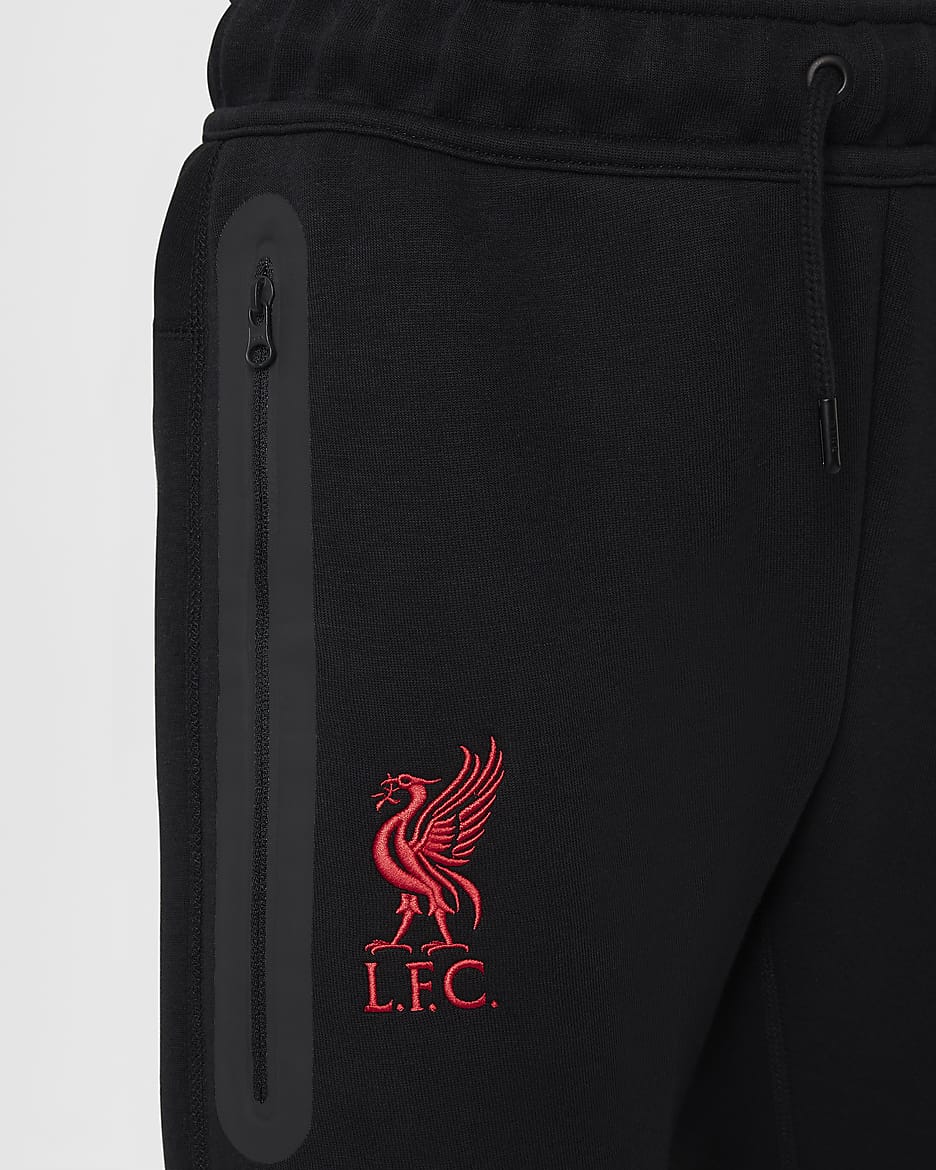 Liverpool FC Tech Fleece Nike Football bukse til store barn (gutt) - Svart/Svart/Gym Red