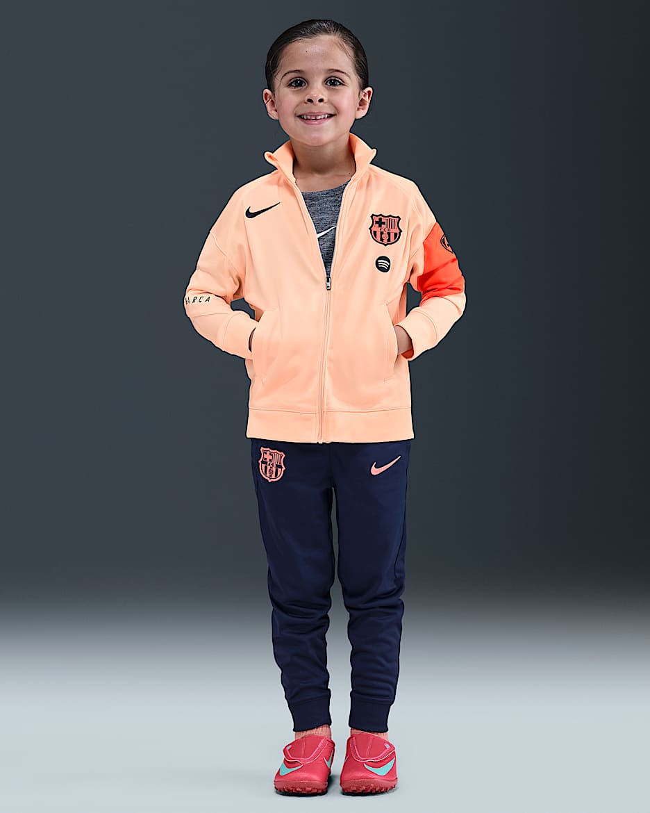 F.C. Barcelona Strike Third Younger Kids' Nike Dri-FIT Total 90 Football Knit Tracksuit - Crimson Tint/Midnight Navy/Bright Mango/Midnight Navy