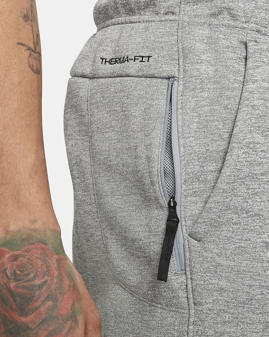 Nike Therma-FIT avsmalnet treningsbukse til herre - Dark Grey Heather/Particle Grey/Svart