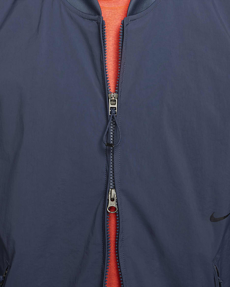 Nike A.P.S. Jaqueta bomber versàtil i repel·lent a l'aigua - Home - Thunder Blue/Negre