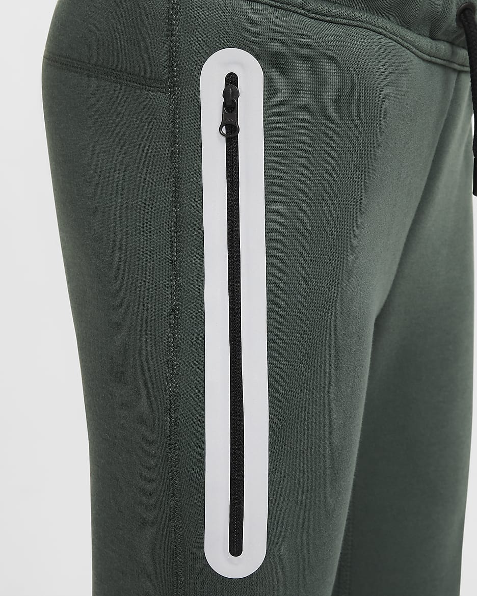 Reflexní běžecké kalhoty Nike Sportswear Tech Fleece pro větší děti - Vintage Green