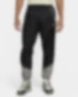 Low Resolution Męskie spodnie z tkaniny z podszewką Nike Windrunner