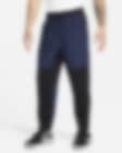 Low Resolution Pants versátiles con cierre en el puño repelentes al agua para hombre Nike Unlimited