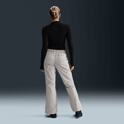 Pantalon à zip taille mi-haute déperlant Nike Sportswear Collection pour femme