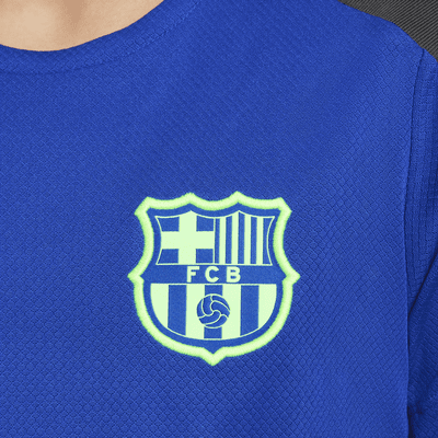 Maglia da calcio a manica corta Nike Dri-FIT FC Barcelona Strike per ragazzo/a – Terza