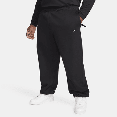 Pants de tejido Fleece con dobladillo abierto para hombre Nike Solo Swoosh