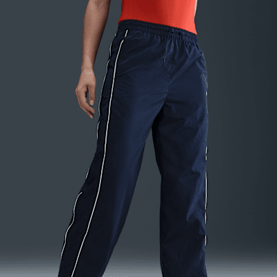 Nike Windrunner Pantalón de talle alto y tejido Woven con dobladillo abierto - Mujer