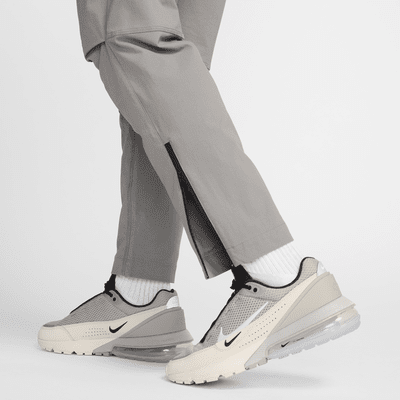 Pantaloni in tessuto Nike Tech – Uomo