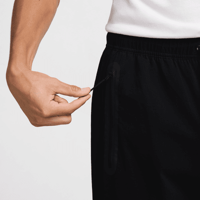 Pantaloni in tessuto Nike Tech – Uomo