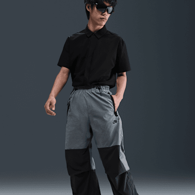 กางเกงขายาวทรงเปิดชายแบบทอผู้ชาย Nike Tech