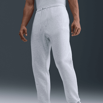 Nike Club Pants de tejido Fleece cepillado con puños para hombre