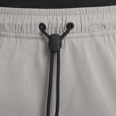 Pantaloni in tessuto Nike Tech – Uomo