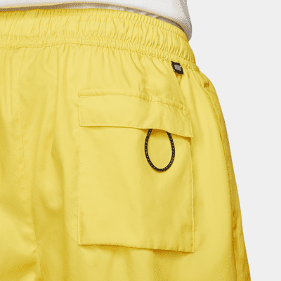 nike club essentials woven flow shorts yellow