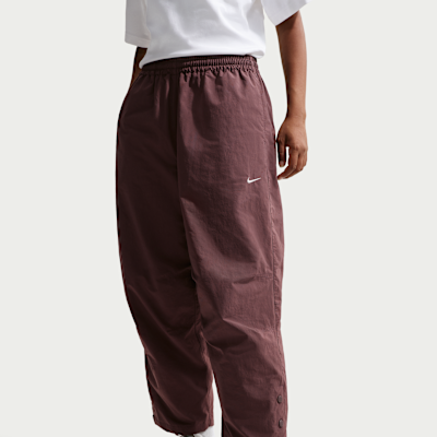 Pants de tejido Woven de tiro alto oversized para mujer Nike Sportswear