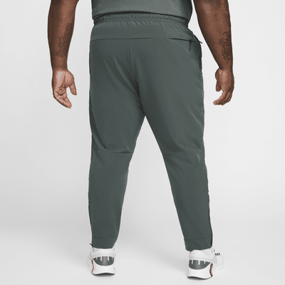 Mångsidiga byxor Nike Unlimited Dri-FIT med mudd med dragkedja för män