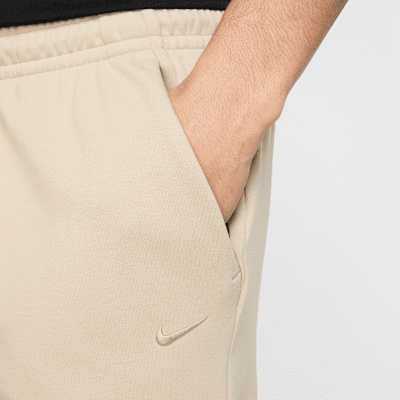 Joggers de alto rendimiento Dri-FIT con protección UV para hombre Nike Primary Fleece