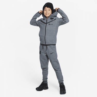 Spodnie piłkarskie dla dużych dzieci (chłopców) Nike FC Barcelona Tech  Fleece (wersja trzecia). Nike PL