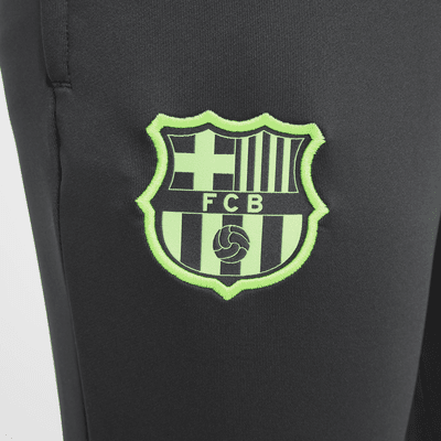 Pantaloni da calcio Nike Dri-FIT FC Barcelona Strike per ragazzo/a – Terza