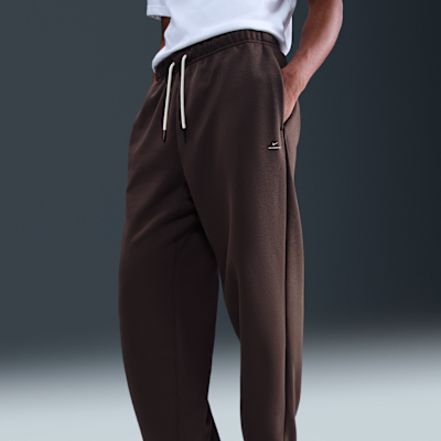 Męskie spodnie do koszykówki ze szczotkowanej dzianiny z luźnymi nogawkami Therma-FIT Nike Standard Issue