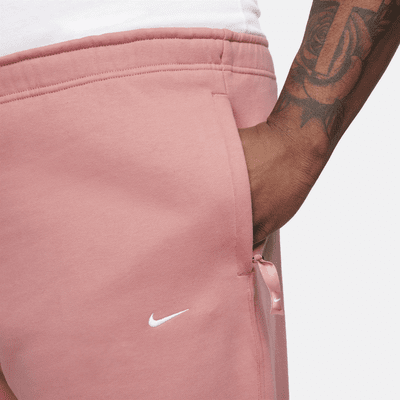 Pants de tejido Fleece con dobladillo abierto para hombre Nike Solo Swoosh